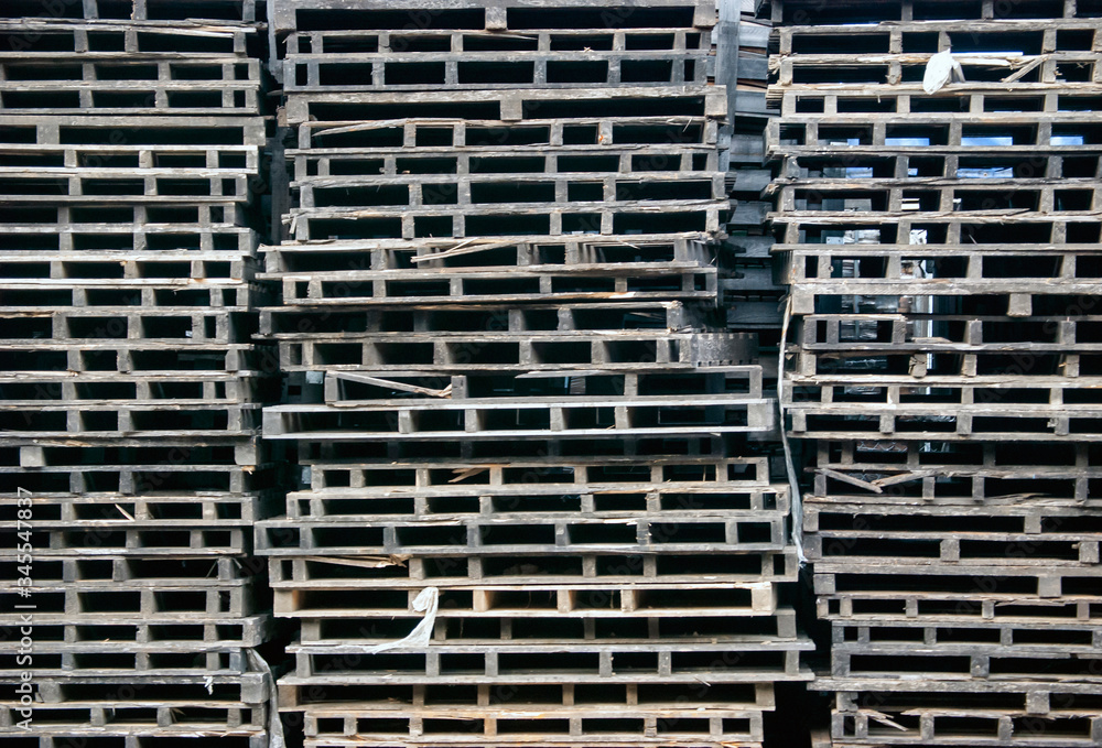 wooden pallets stacked high giving the effect of a structure wooden pallets stacked high giving the effect of a structure
