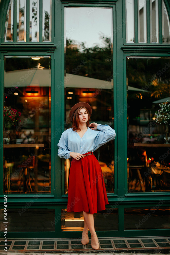 © Kateryna Ivaskevych - young woman walking on the street in a dress