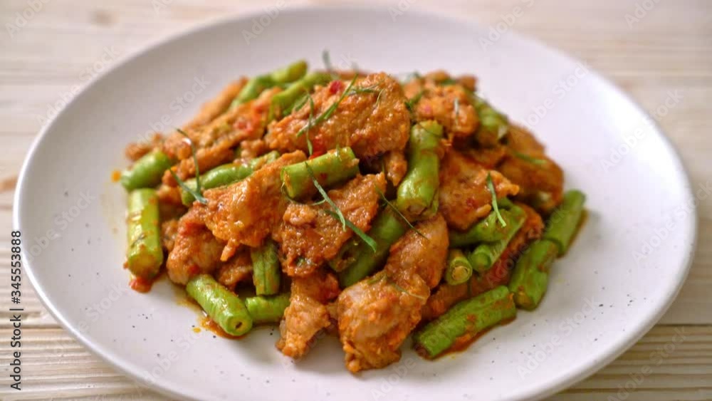 Stir fried pork and red curry paste with sting bean - Asian food style Stir fried pork and red curry paste with sting bean - Asian food style