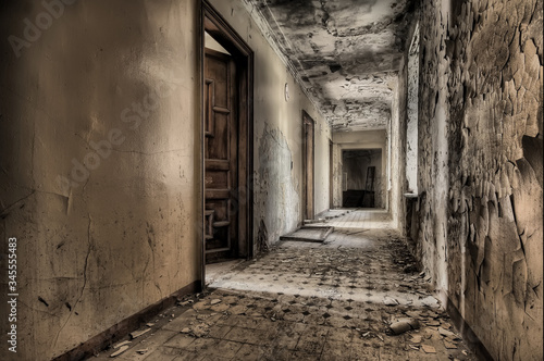 Corridor with ancient doors in an abandoned house 