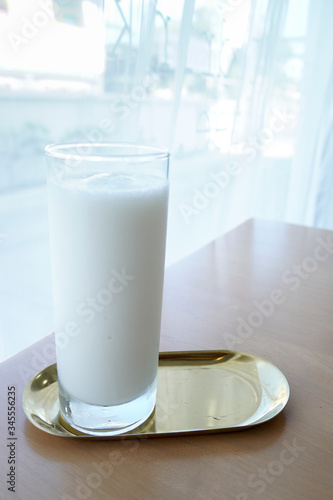 milk shake in tall glasses on the table.