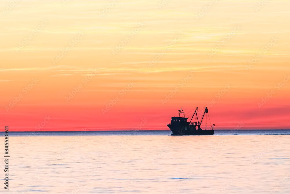 The trawler in the sea in the fishing