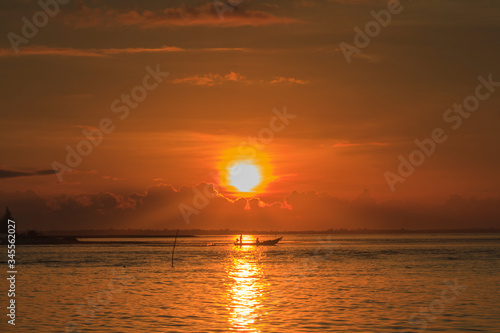 Silhouette of fisherman catching fish early in the morning at Laem Ta Chi  Pattani  Thailand