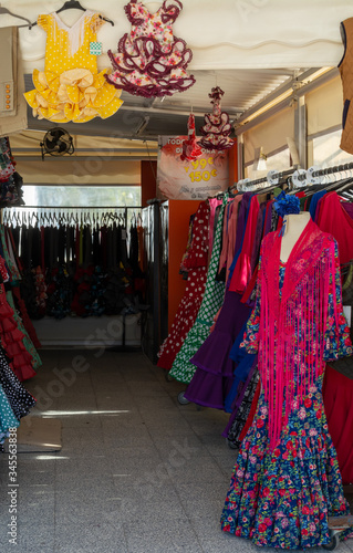 September 9, 2019, El Rocio, Andalusia, Spain. Shop with traditional colorful spanish flamenco dresses © barmalini