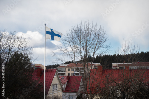 Finnish flag and red houses. 