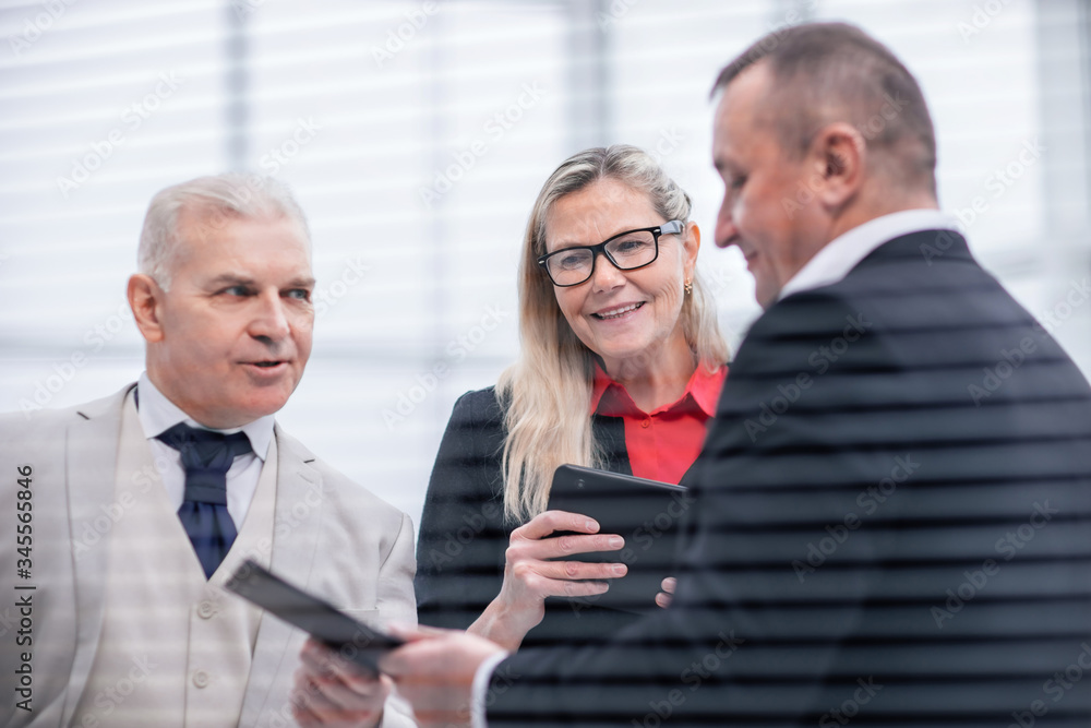 close up. project Manager discussing with employees working documents. close up. project Manager discussing with employees working documents.