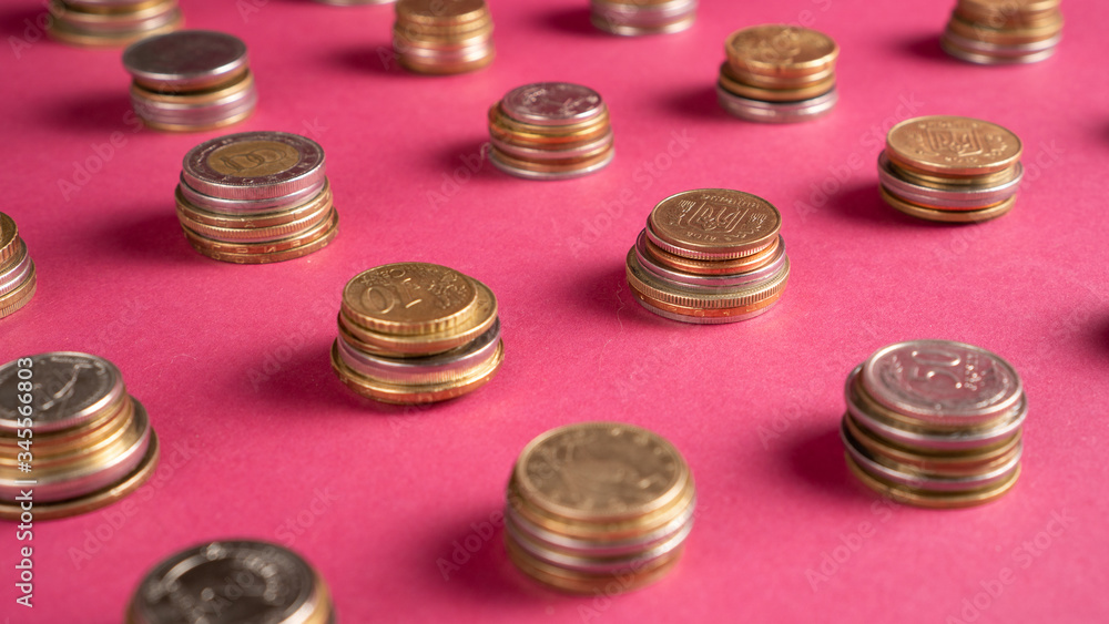Piled coins. Stack of pennies on colored background. Money financial saving concept. Collecting coins, numismatist Piled coins. Stack of pennies on colored background. Money financial saving concept. Collecting coins, numismatist
