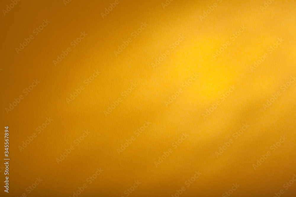 Fototapeta premium a yellow background texture, top backlight. panorama