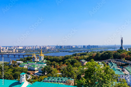 View of Kiev Pechersk Lavra (Kiev Monastery of the Caves),  Motherland Monument and the Dnieper river in Ukraine. View from Great Lavra Bell Tower
