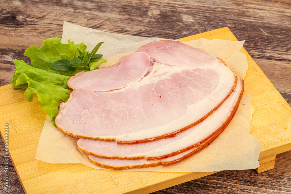 Sliced pork belly over board