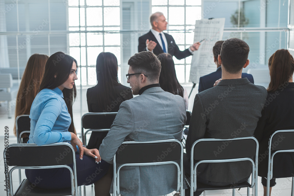 rear view. group of employees sitting in the conference room rear view. group of employees sitting in the conference room