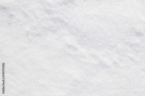 Closeup white icy snow surface texture background.