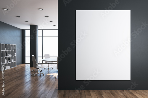 Modern meeting room with blank poster on gray wall. © Who is Danny