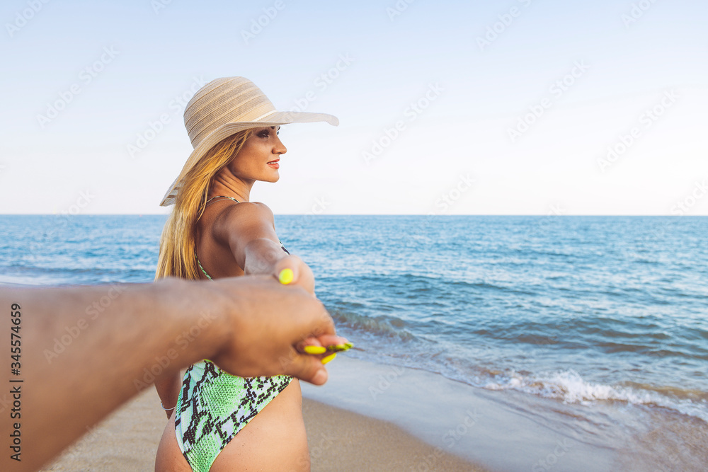 follow me shot of a woman leading her boyfriend