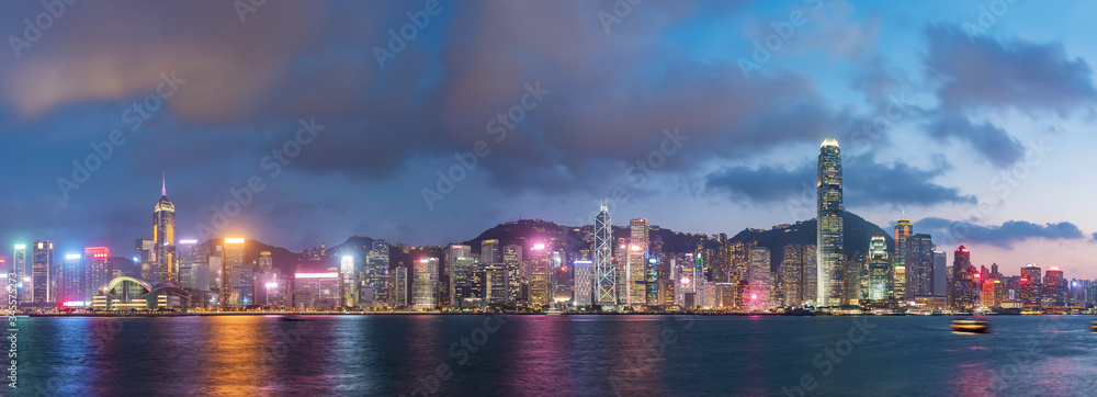 Fototapeta premium Panorama of Victoria harbor of Hong Kong city at dusk