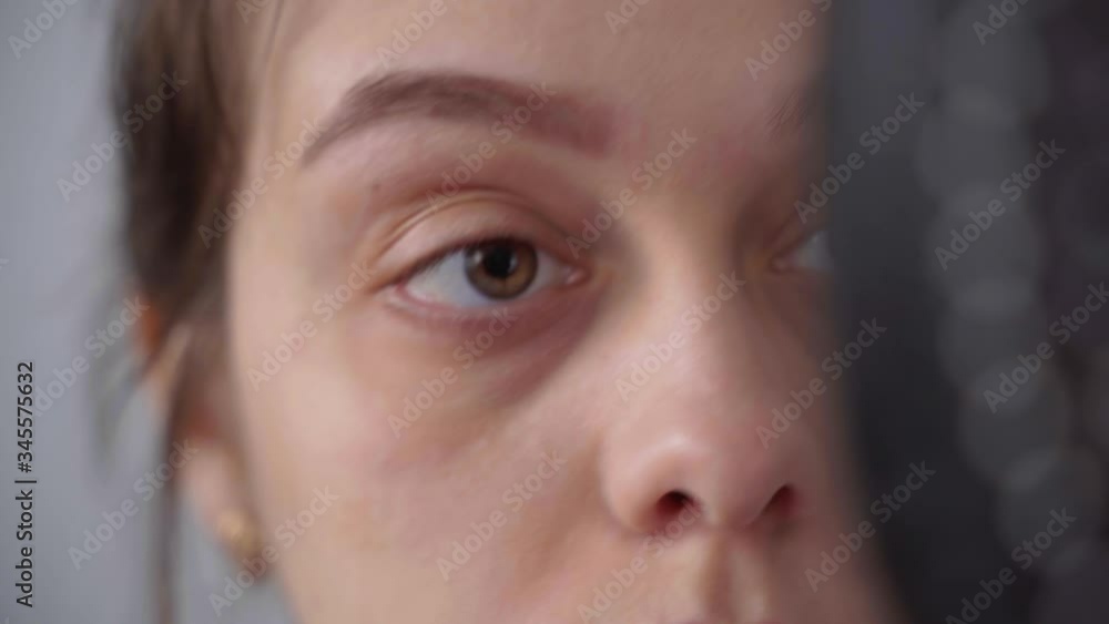 The girl colors her eyebrows with brown shades. Close-up The girl colors her eyebrows with brown shades. Close-up