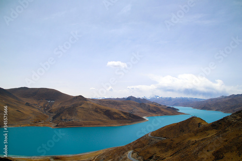 The brown peaks of YamdrokTso, the blue-green sacred lake, and Mani Dui and the dancing prayer flags. © TOM.zzl
