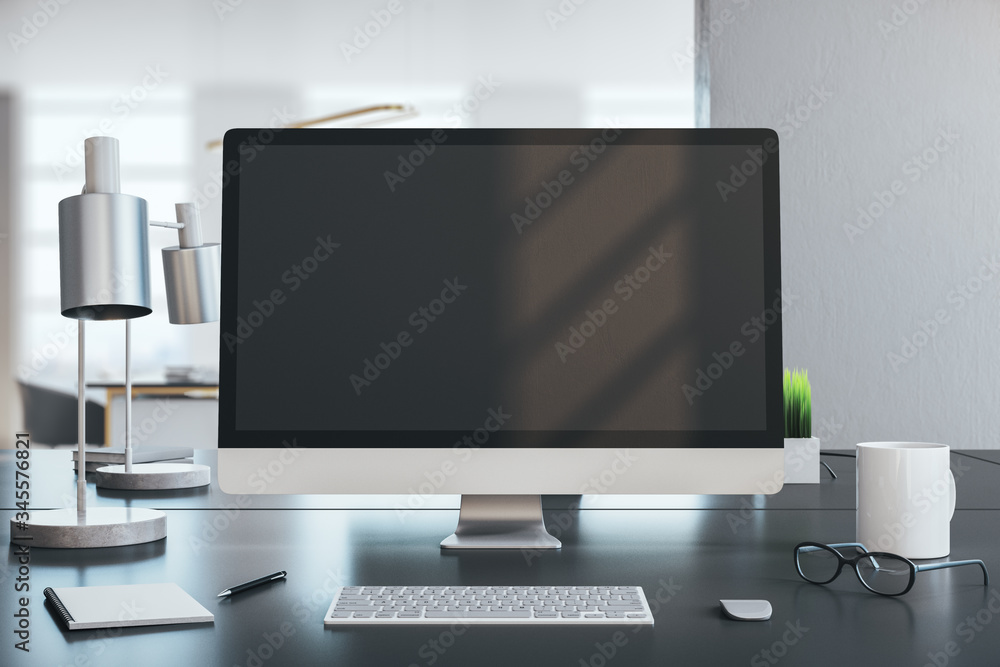 Modern designer desktop with black computer screen Modern designer desktop with black computer screen