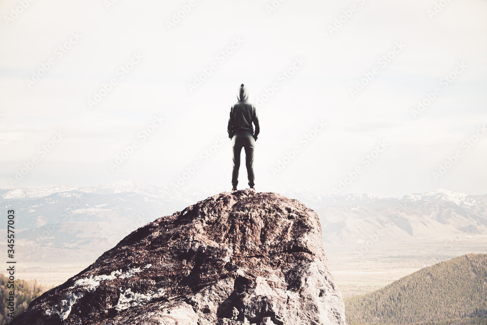Hacker standing on abstract mountain