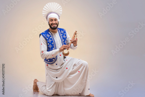 Portrait Of Sikh Man Doing Bhangra Dance  © IndiaPix
