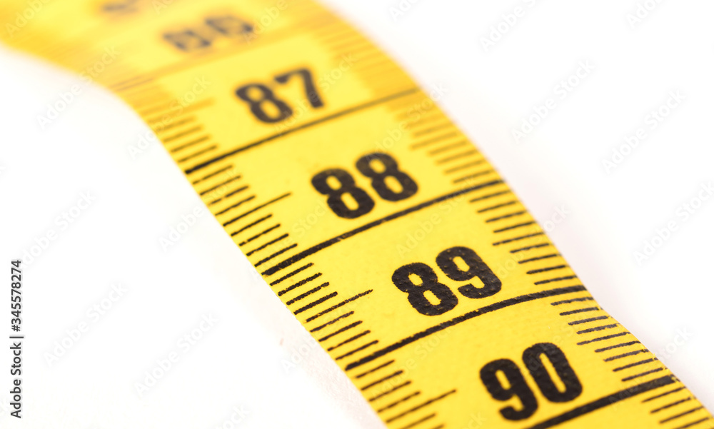 Close-up of a yellow measuring tape isolated on white - 89 Close-up of a yellow measuring tape isolated on white - 89