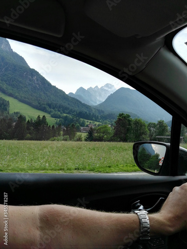 Shot out of driving car with mountains