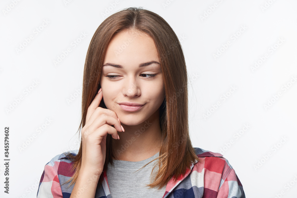 Closeup portrait of thinking teen girl looking to side Closeup portrait of thinking teen girl looking to side