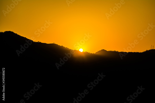 Wallpaper Mural Sunrise behind the mountains of Rishikesh, Located in the foothills of the Himalayas in northern India,
 Torontodigital.ca