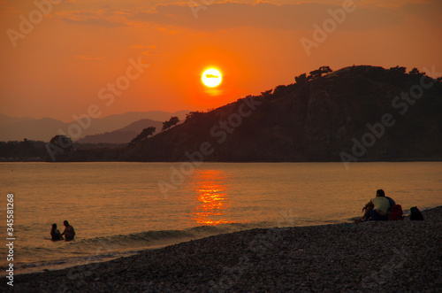 FETHIYE, TURKEY - June, 2019: Sunset on the Calis Beach on the Aegean Sea