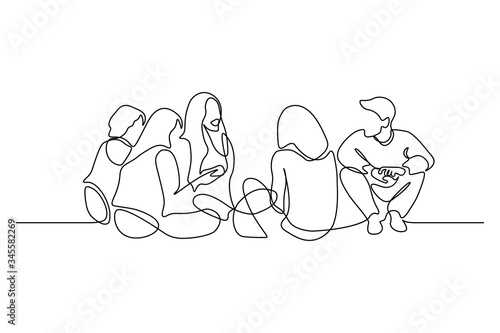 Group of young people sitting on ground together and talking. Friends rest and communicate. Continuous line art drawing style. Minimalist black linear sketch on white background. Vector illustration