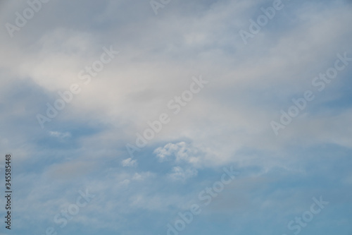 Fototapeta Naklejka Na Ścianę i Meble -  white-gray smoky clouds against the blue sky