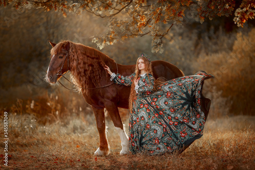 Canvas Print Beautiful long-haired blonde young woman in national russian style with red Vlad