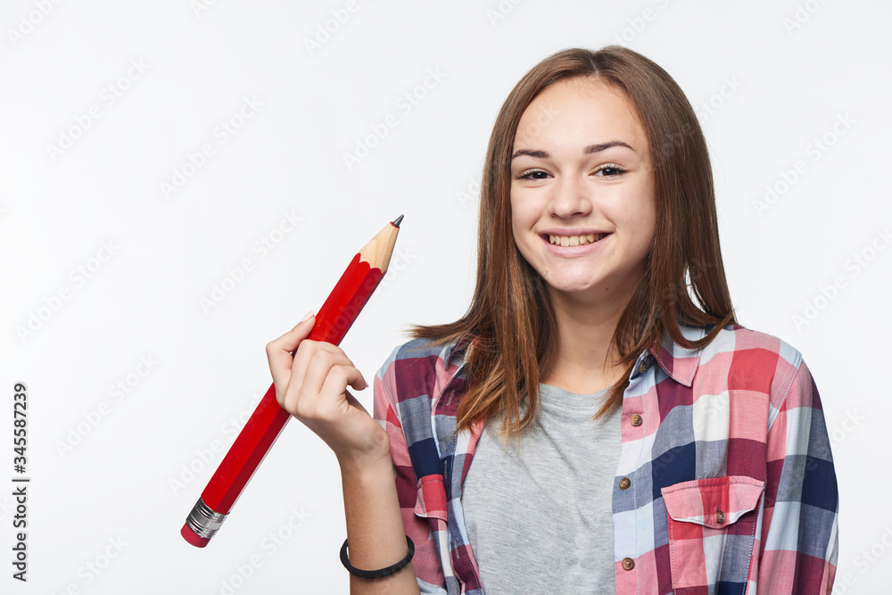 Smiling relaxed teen girl looking at camera over shoulder Smiling relaxed teen girl looking at camera over shoulder