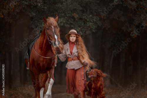 Canvas Print Beautiful long-haired blonde young woman in English style with red draft horse,