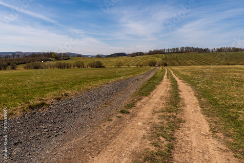 pasture in a mountain area in spring with blue sky