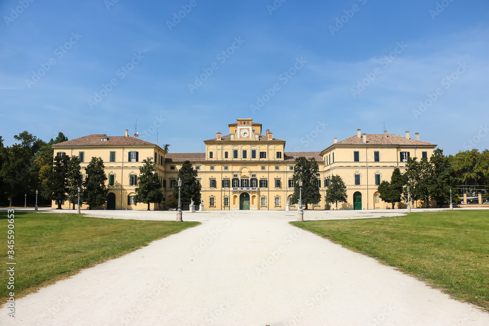 Parma, Italy. Beautiful architecture of Ducal Palace (Palazzo Ducale di Parma) in community garden (Parco Ducale).