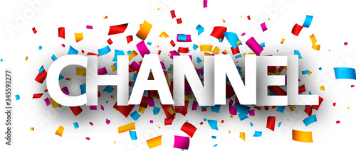 Capital letters paper sign over confetti background.