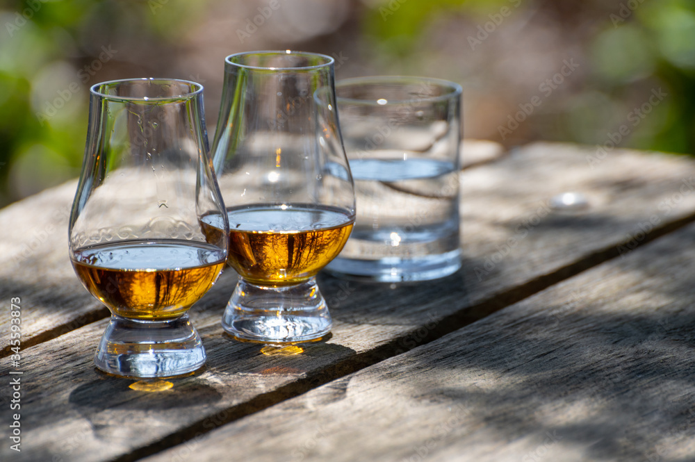Tasting of scotch single malt whisky from Islay island, most intensely flavoured of all whiskies in Scotland Tasting of scotch single malt whisky from Islay island, most intensely flavoured of all whiskies in Scotland