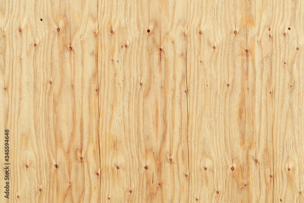 hellbraune Holzwand an einem Bauzaun mit Astlöchern hellbraune Holzwand an einem Bauzaun mit Astlöchern