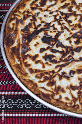 Traditional Turkish cheese pienamed Suborek, Chebureki or Suberek. photo