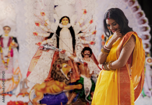 Portrait of a beautiful Married Bengali woman , during Durga puja celebrations 