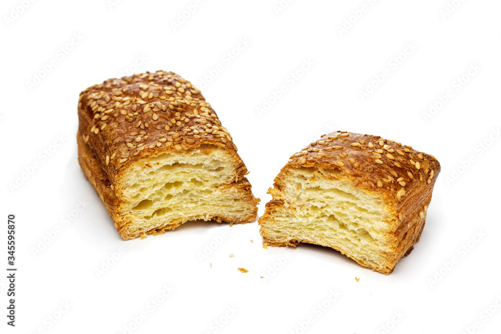 Slices baked cheese bun made of puff pastry with sesame seeds. Slices bun with sesame isolated on white background.