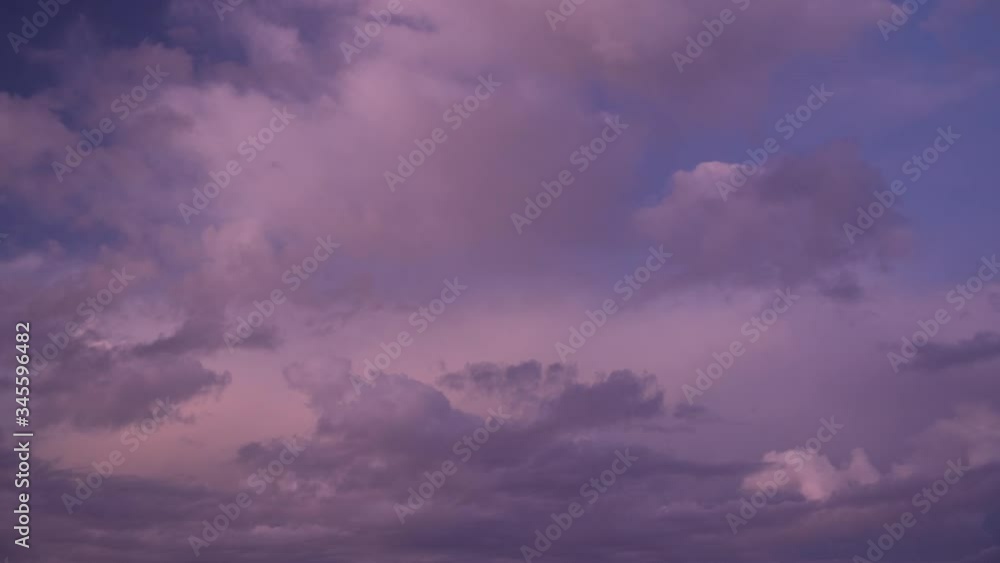 Timelapse of pretty cloudy sky at sunset dusk, clouds blowing away to reveal blue sky and stars. Timelapse of pretty cloudy sky at sunset dusk, clouds blowing away to reveal blue sky and stars.