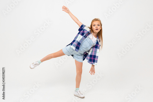 portrait of happy european girl waving hands on white wall with copyspace