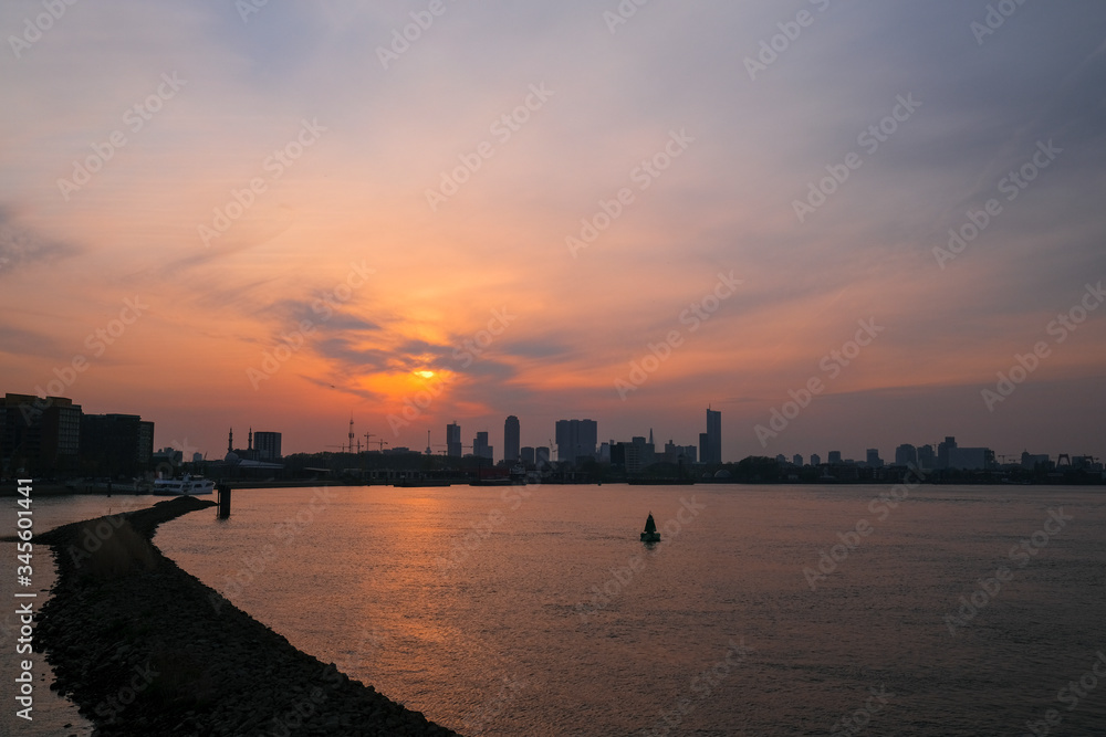 Rotterdam Skyline with Erasmusbrug bridge at sunset in morning in Rotterdam, Netherlands