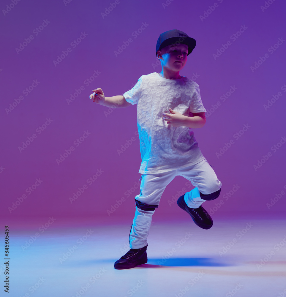 Cool young boy child dancing hip hop in the Studio against the background  of neon lights. Break dance poster. Stock Photo | Adobe Stock