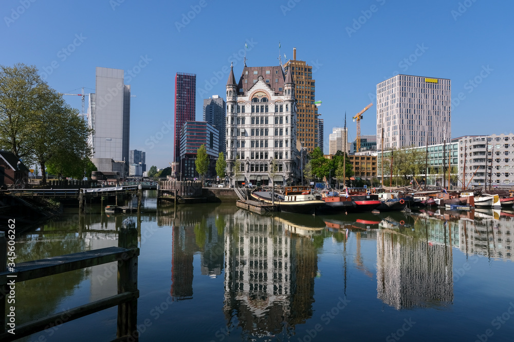 Oudehaven Harbor with historical houseboats with the White House. Witte Huis and Willemsbrug Bridge in the background - Rotterdam, Netherlands
