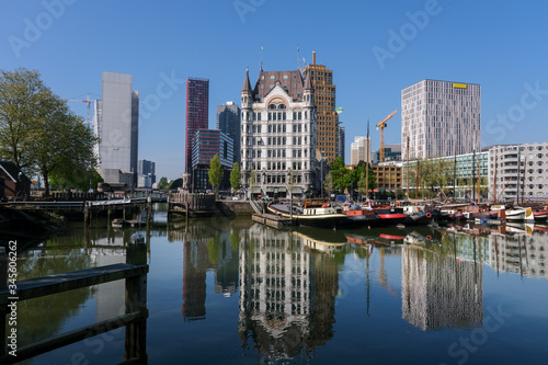 Oudehaven Harbor with historical houseboats with the White House. Witte Huis and Willemsbrug Bridge in the background - Rotterdam  Netherlands