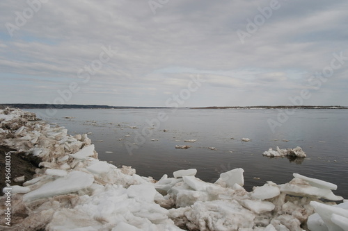 Obraz na plátne Ice hummocks after an ice drift near the high Bank