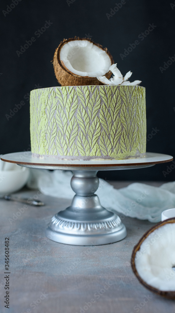 Fototapeta premium Delicious cake with coconut and pieces of pineapple inside.